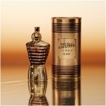 Jean Paul Gaultier Le Male Elixir men's perfume in an iconic gold and amber striped torso bottle.