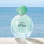Giorgio Armani Acqua di Gioia Eau de Parfum for women, in a transparent glass bottle with a round emerald green cap, highlighting its fresh aquatic scent with notes of lemon, water jasmine, and cedarwood.